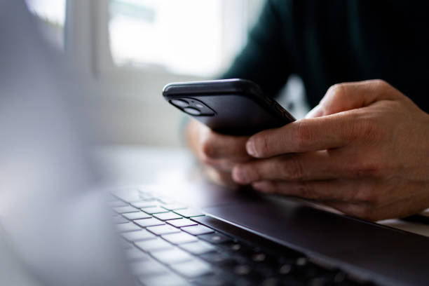 focus on man hands typing message